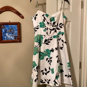 Glamorous white dress with green flowers